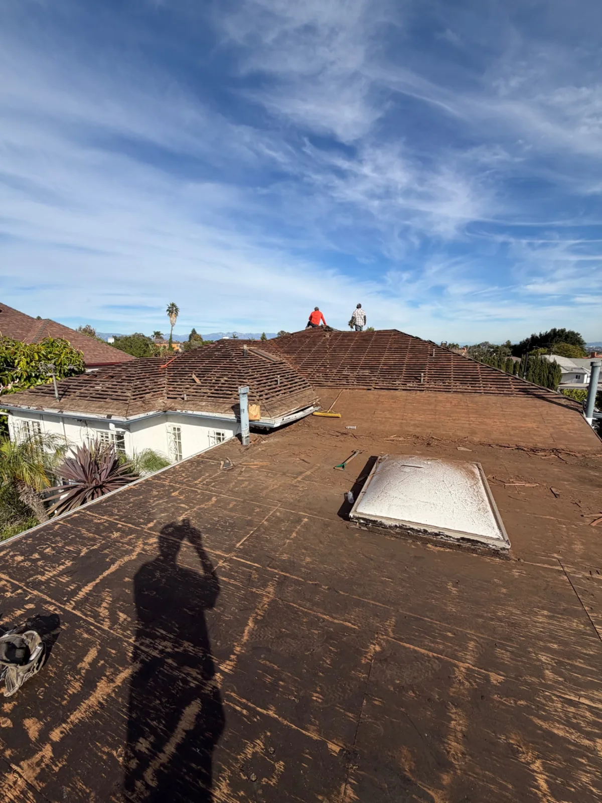 Roof tear-off in progress on a Los Angeles home